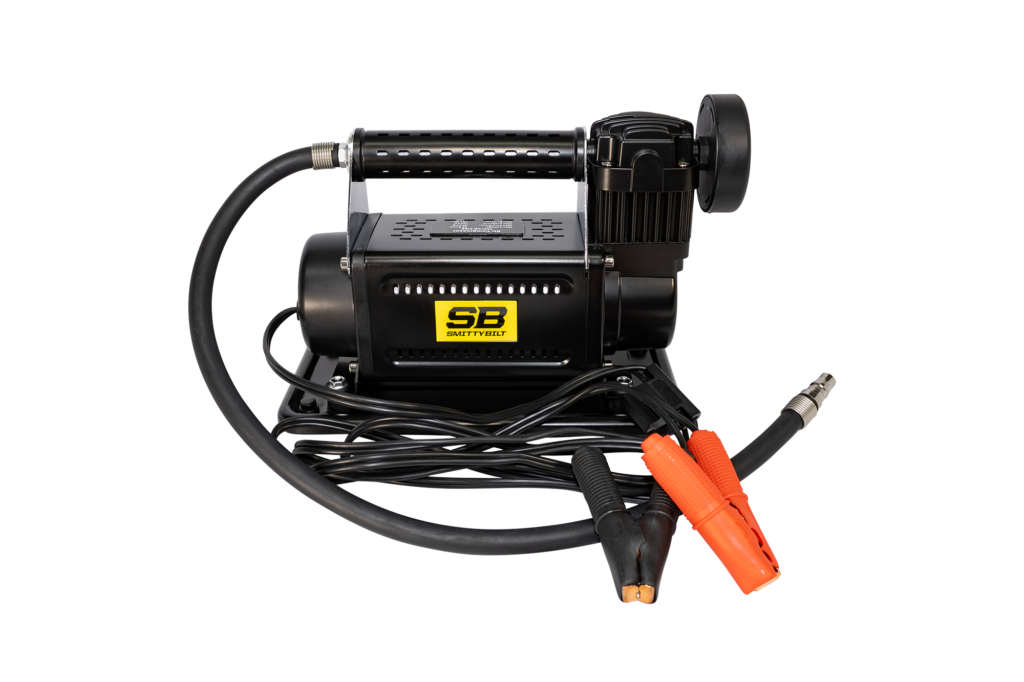 Smittybilt portable air compressor with battery clamps, air hose, and inflation chuck